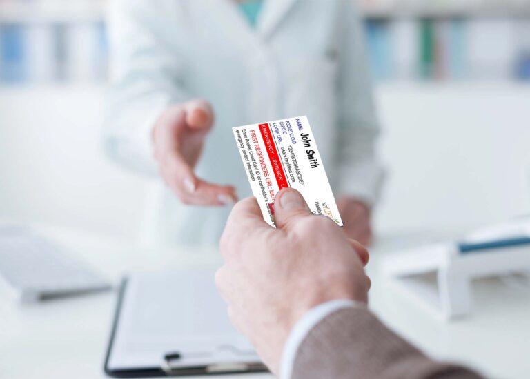 Man handing MyLifeID digital health record ID card to doctor to download medical files